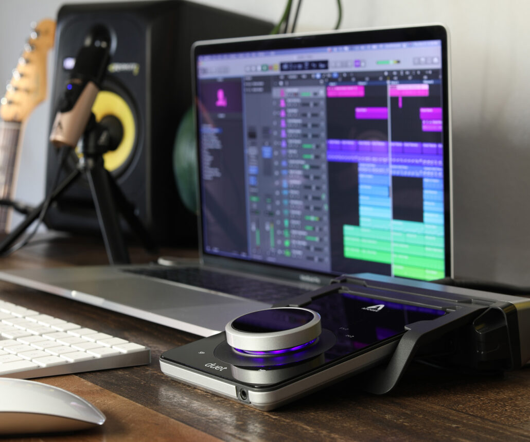 Apogee Duet on dock by laptop and speakers